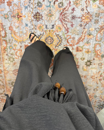 Pantalone con perline in legno