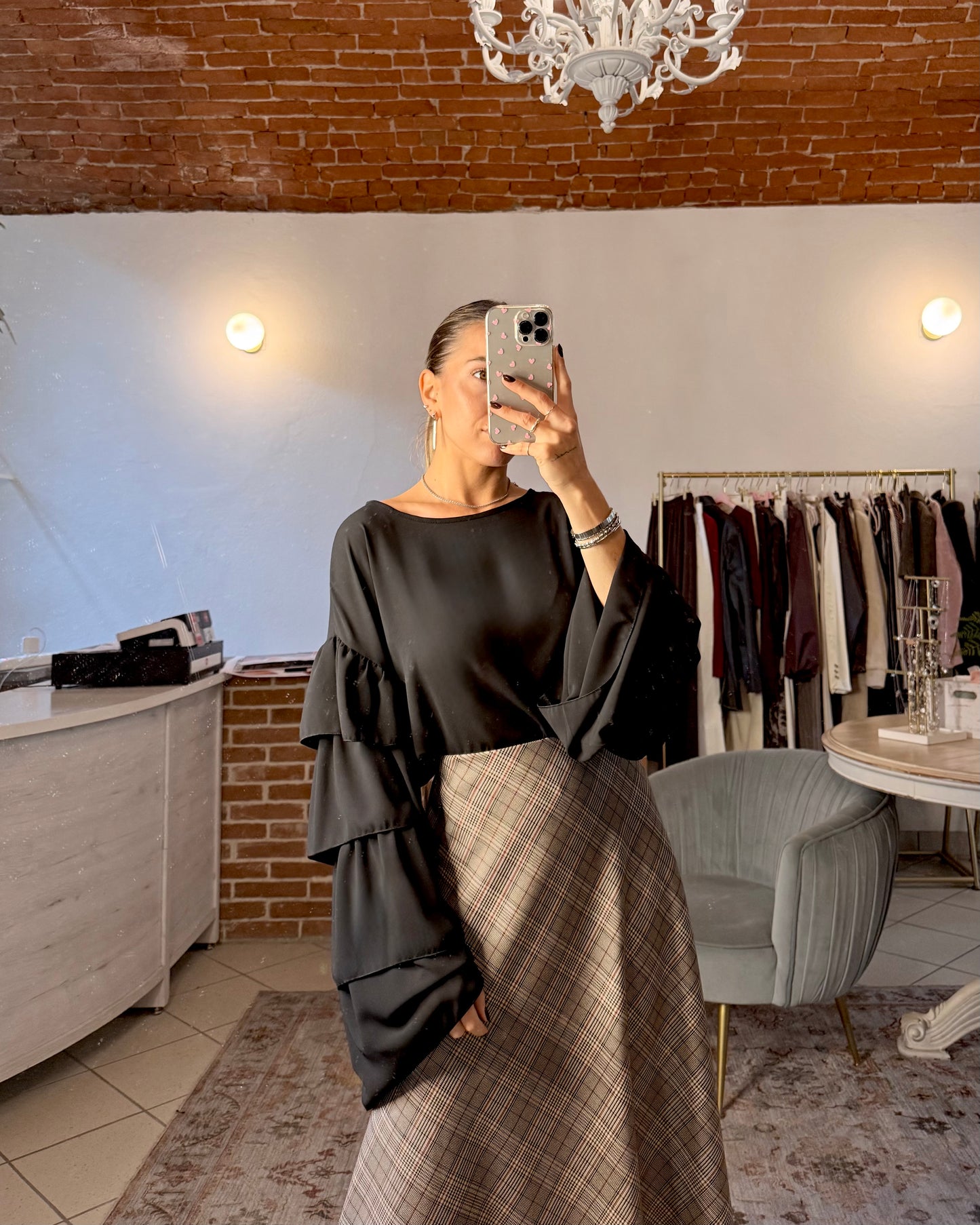 Blusa con maniche ampie a balze